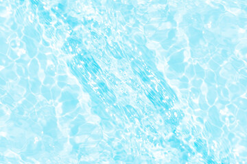 Blue water with ripples on the surface. Defocus blurred transparent blue colored clear calm water...