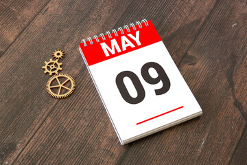 9 May text on wooden blocks with customizable space for text or messages.