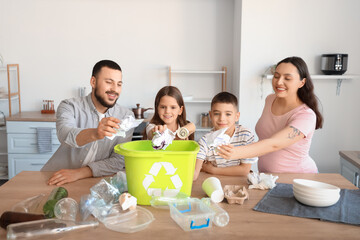 Family sorting paper garbage in kitchen. Global Recycling Day