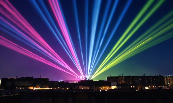 Colorful laser beams projecting over city skyline at night.