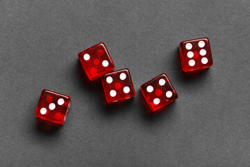 Red game dices on grey background