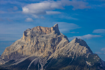 Dolomites, Alpi Dolomiti beautiful scenic mountain landscape under blue sky in summer. Rocky tower peak summits of the Alps on a sunny day. Alpine scenic view of the cliffs and climbing walls in Italy