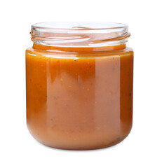Tasty curry sauce in glass jar isolated on white
