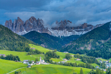 Dolomites, Alpi Dolomiti beautiful scenic mountain landscape under blue sky in summer. Rocky tower peak summits of the Alps on a sunny day. Alpine scenic view of the cliffs and climbing walls in Italy