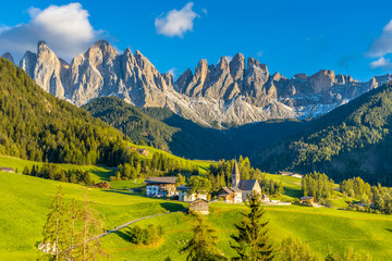 Dolomites, Alpi Dolomiti beautiful scenic mountain landscape under blue sky in summer. Rocky tower peak summits of the Alps on a sunny day. Alpine scenic view of the cliffs and climbing walls in Italy