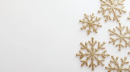 Minimalist white Christmas card embossed golden snowflakes placed on a clean white background