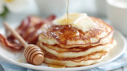 Delicious Buttery Pancakes with Syrup and Bacon Breakfast