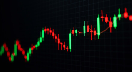 A close up of a stock chart with green and red candlesticks on a dark background with grid lines