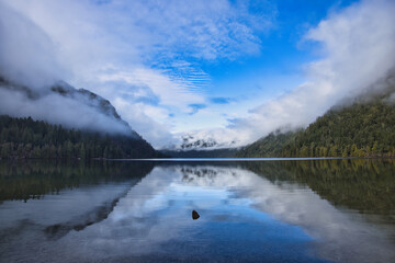 Moody forest landscape whit fog and mist at Cameron Lake, Vancouver Island, British Colombia, Canada