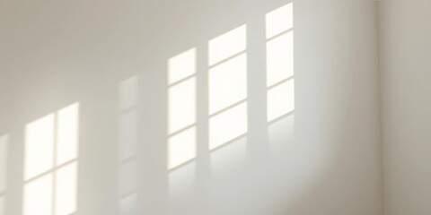 Fototapeta premium Abstract light and shadow patterns cast by window on pristine white interior wall, sunbeams , space, contrast