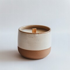 Ceramic soy candle with wooden wick on white background