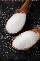 closeup of pure natural salt in a wooden spoon