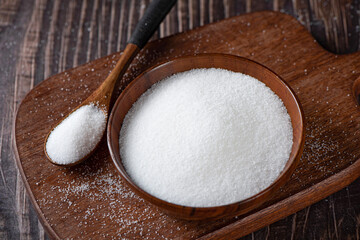 pure natural salt on wooden table.