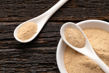 Organic Peruvian maca powder - Lepidium meyenii in bowl and spoon.
