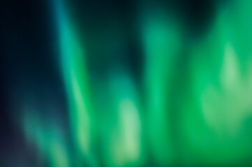 Cool blue green background created in camera with a lens with overlapping bokeh abstract soft edges light and dark areas with room for copy and text