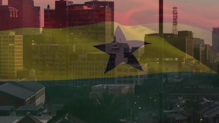 Animation of Ghana flag overlaying cityscape at sunset with buildings and skyline - Powered by Adobe