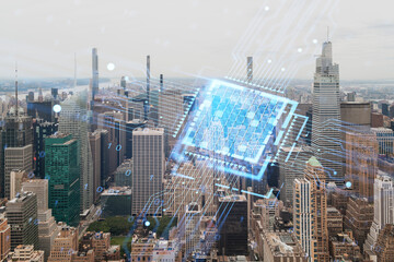 Double exposure of a holographic computer interface over New York cityscape. Technology and security concept. Double exposure