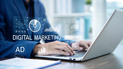 Person in blue suit using laptop with digital marketing graphics overlayed on the screen view