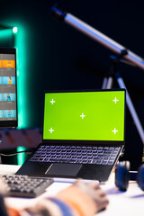 African american photo designer retouching images next to green screen on dual screens in a tech...