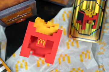 Fototapeta premium Bangkok, Thailand - April 10, 2025 : Fry Helmet Minecraft from McDonald, Toy form Minecraft blind box from McDonald's collaborates Minecraft the movice