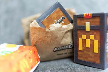 Fototapeta premium Bangkok, Thailand - April 10, 2025 : Box form McDonald’s Minecraft collectibles. Minecraft toy random box.