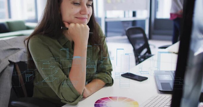 Viewing digital architectural models on computer screen, woman smiling at desk