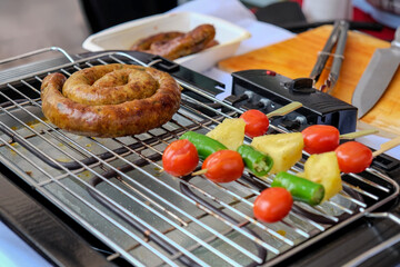 Roasting Thai's style spicy sausages and vegetables bbq