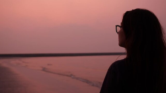 The Serene Sunset Reflections by the Beautiful Shoreline Make for a Tranquil Experience
