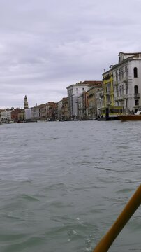 Gondolier rowing gondola on grand canal in venice, Italy. Action