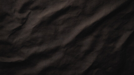 Soft black fabric texture with subtle wrinkles and depth, creating rich visual appeal