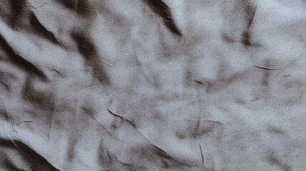 Wrinkled fabric texture in neutral tones creates vintage feel, adding depth and character