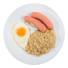 Breakfast is made from boiled oatmeal, fried egg and boiled sausages. Isolated over white background