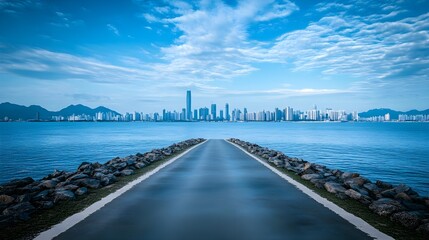 Fototapeta premium Distant View of City Skyline Against Serene Sky and Sea