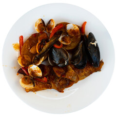 Traditional Spanish dish Merluza la marinera - hake fish fillet with mussels. Isolated over white background