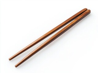 Wooden chopsticks placed on a clean white surface