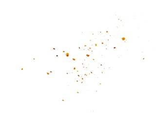 Dried red chili powder flying. Grainy scatterings of spicy burst . Splashes of red pepper powder.Overlay effect chilli or paprika spice splatters.