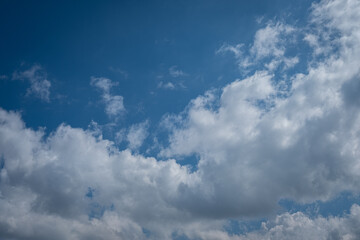 white cumulus clouds in blue sky