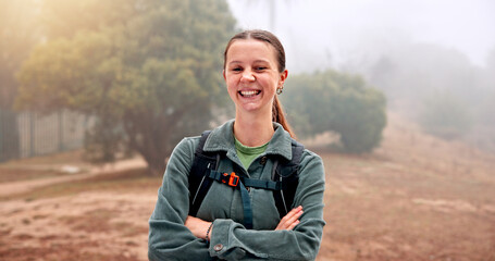 Hiking, portrait and arms crossed with woman in nature for fitness, travel and adventure holiday. Explore, trekking and environment with person outdoor for eco tourism, backpacking and vacation trip