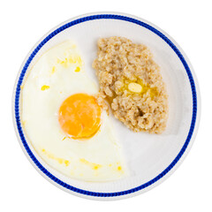 Breakfast with scrambled eggs and oatmeal with butter. Isolated over white background