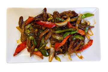 Pork stew with sauteed onions, tomatoes and bell peppers. Chinese cuisine. Isolated over white background