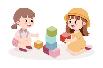 Two happy little girls are playing together with colorful building blocks, stacking them up.