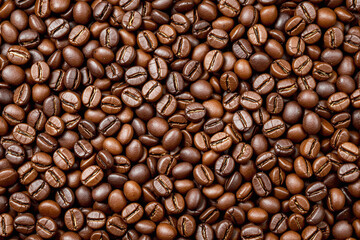 Fototapeta premium Roasted coffee beans in a detailed close-up forming a seamless brown background, natural texture for drinks concepts and cafe themes. Ai generative