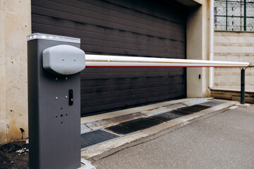 A multilevel parking garage, prominently featuring a no entry sign on its side