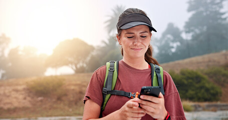 Hiking, reading and phone with woman in nature for social media post, travel and adventure. Networking app, trekking and environment with person and mobile for eco tourism, backpacking and vacation