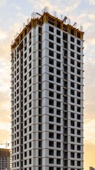 Construction Site to Eco Finished Project, Modern Building Under Construction with Scaffold and Clear Sky Background at Sunrise