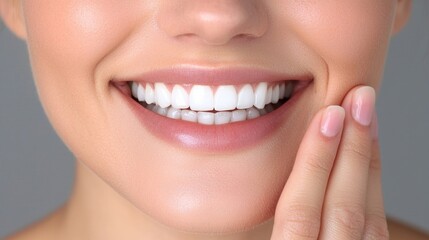 Obraz premium Close-up of a woman's healthy, bright smile. Soft focus