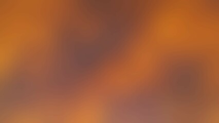 Abstract blurred background image featuring a blend of warm, earthy tones. The shades range from deep browns to lighter oranges, creating a smooth, indistinct texture. 