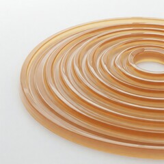 Concentric waves in glossy gelatin on pure white background