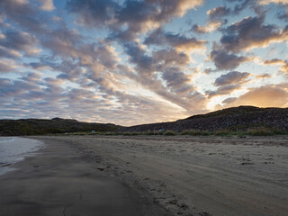 Sunseton on the beach in Teriberka, on the Barents Sea in the Murmansk region of northern Russia