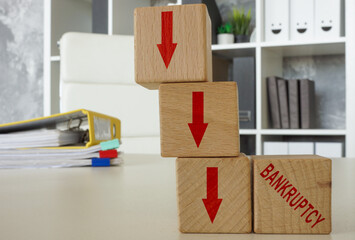 Downward arrows and the word bankruptcy.